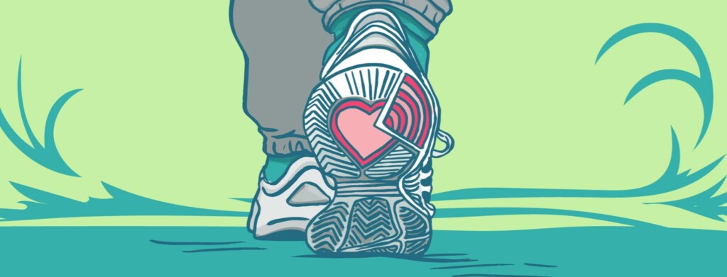 Sole of a shoe sneaker on a person on a walk in the park, showing a heart.