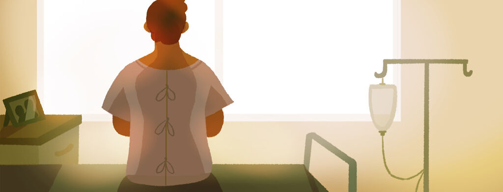 A man in a hospital gown sits on his bed in a hopeful sunrise